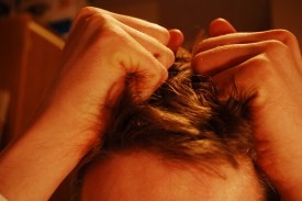Stressed man pulling hair [CC]