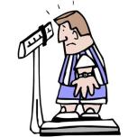 Man weighing himself on a scale [CC]