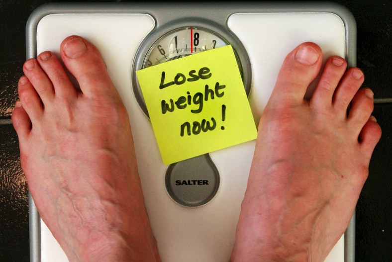 Lose Weight Now - Man's Feet on Scale (CC)