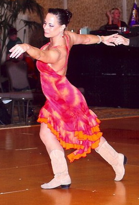 Terri Bordeaux dancing with one of her students in a competition